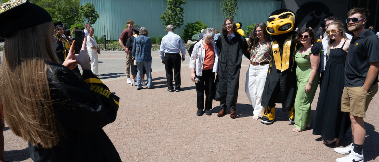Graduates and Guests with Herky at Carver